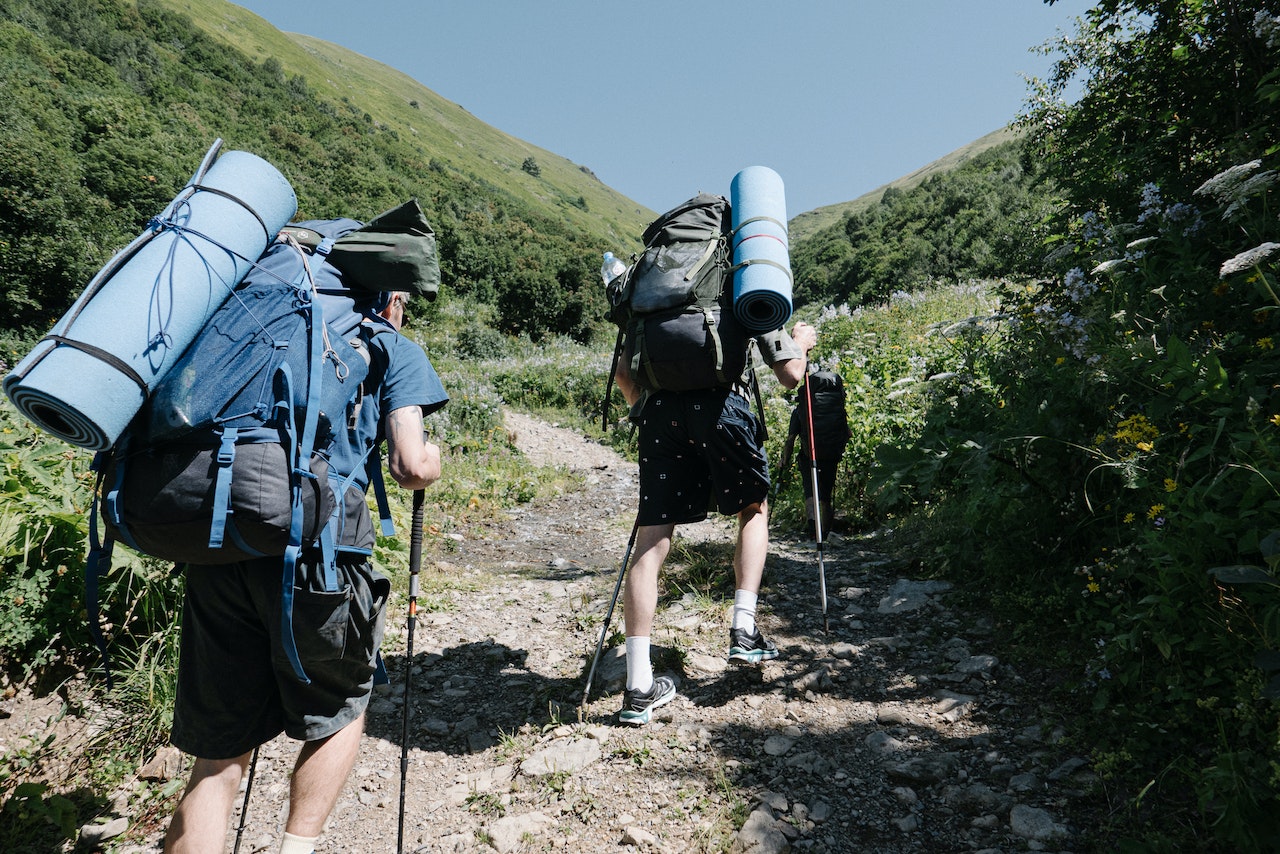 Two People Hiking on a Mountain | Veteran Car Donations