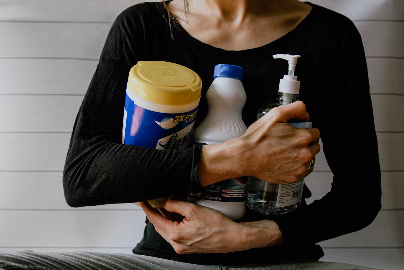 Woman Holding Cleaning Supplies | Veteran Car Donations