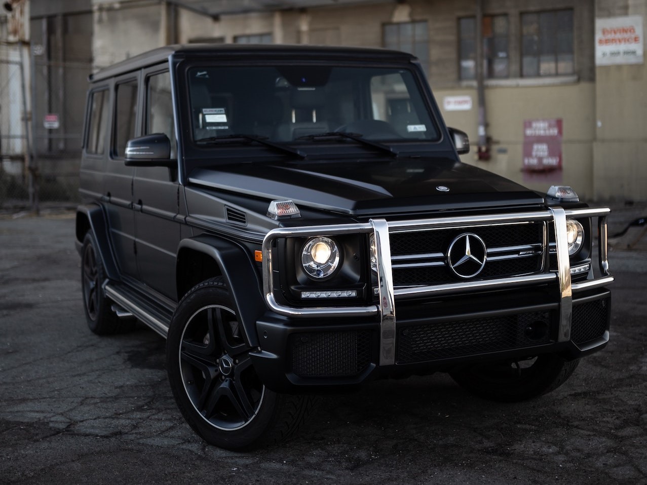 Black Suv Parked on Pavement | Veteran Car Donations