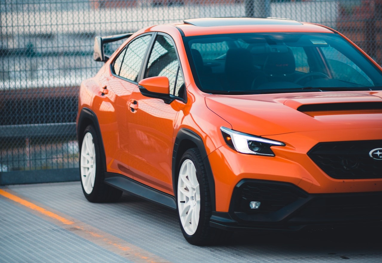 Photo of Orange Sedan Parked | Veteran Car Donations