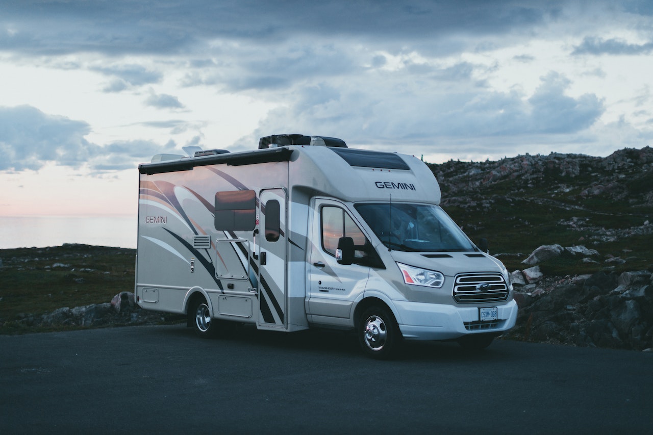 White Cargo Van Parked on a Vacant Lot | Veteran Car Donations