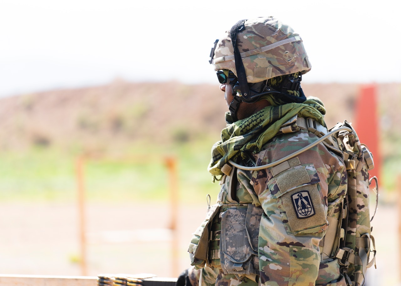 Man in Green and Brown Camouflage Uniform | Veteran Car Donations
