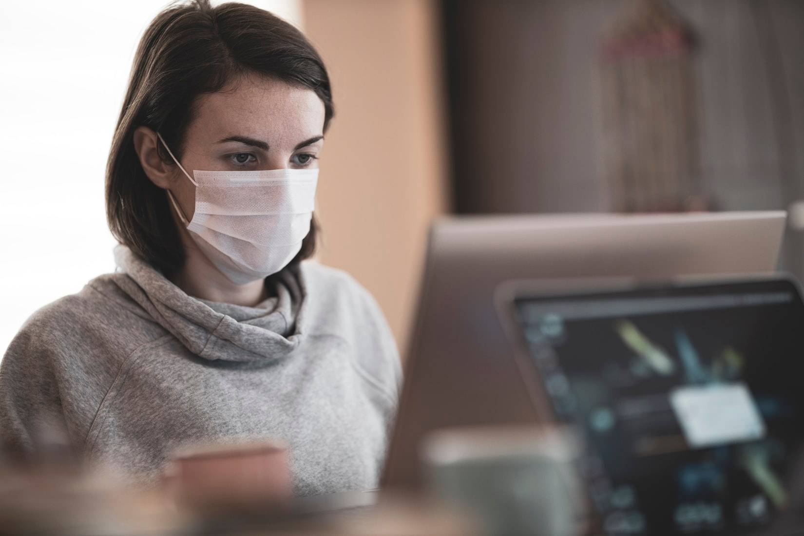 Person Working with Face Mask On | Veteran Car Donations