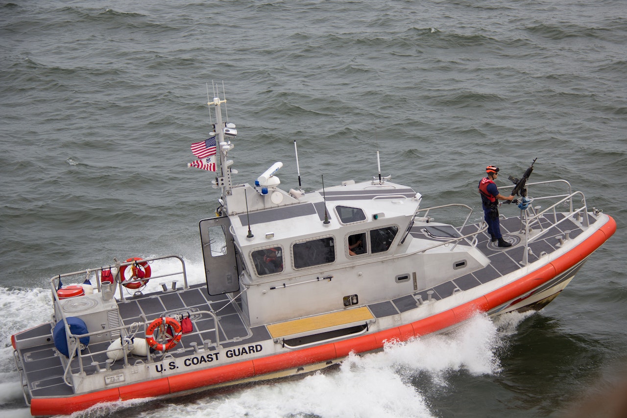 White Orange U.S. Coast Guard Boat on the Sea | Veteran Car Donations
