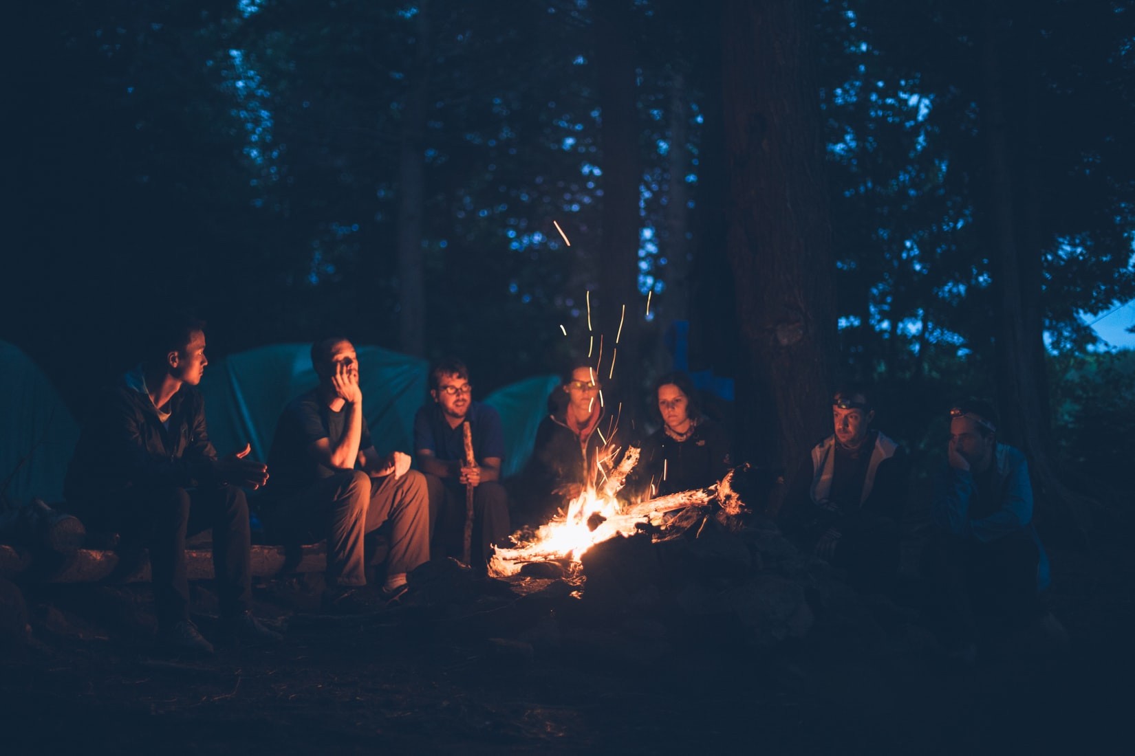 Friends Enjoying Campfire | Veteran Car Donations