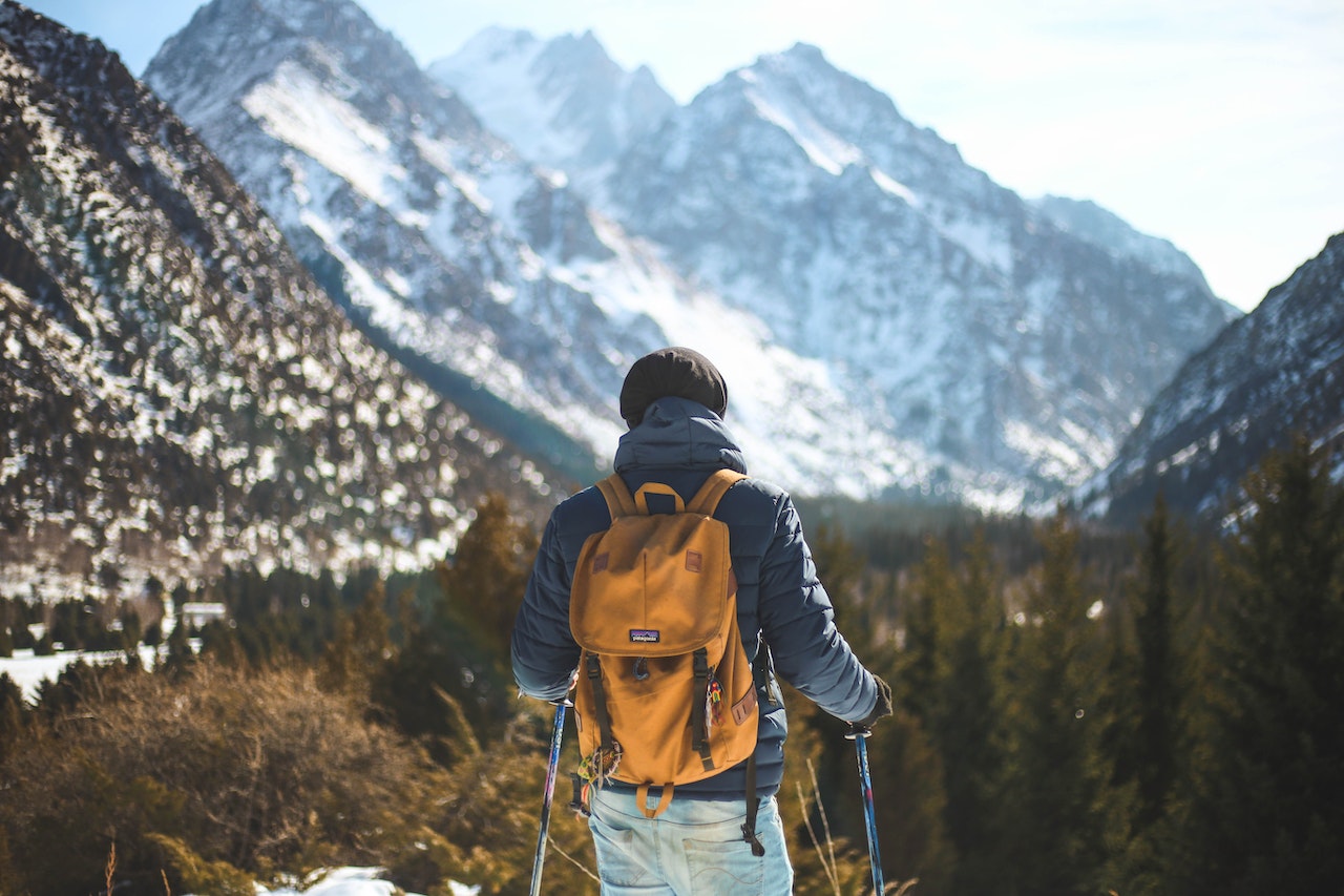 Men's Blue Leather Jacket and Brown Backpack | Veteran Car Donations