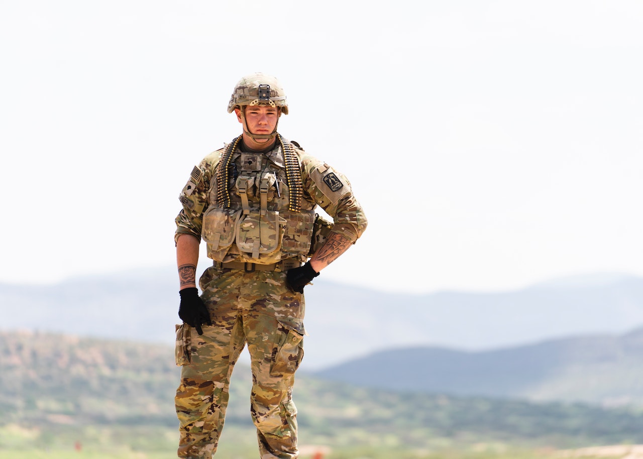 Unarmed US Soldier in Field Camo Uniform with Mountains in Background | Veteran Car Donations
