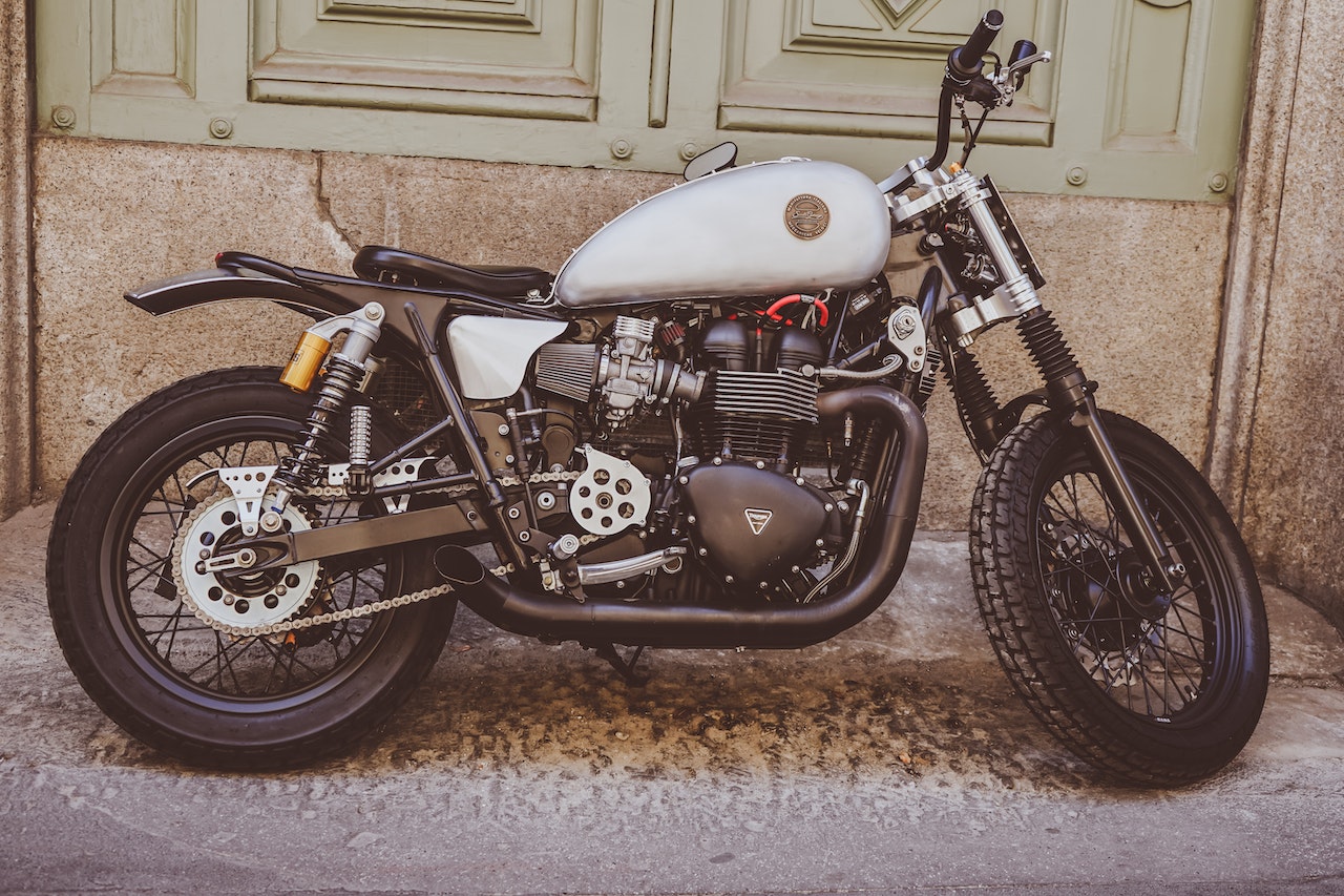 White and Black Bobber Bike | Veteran Car Donations