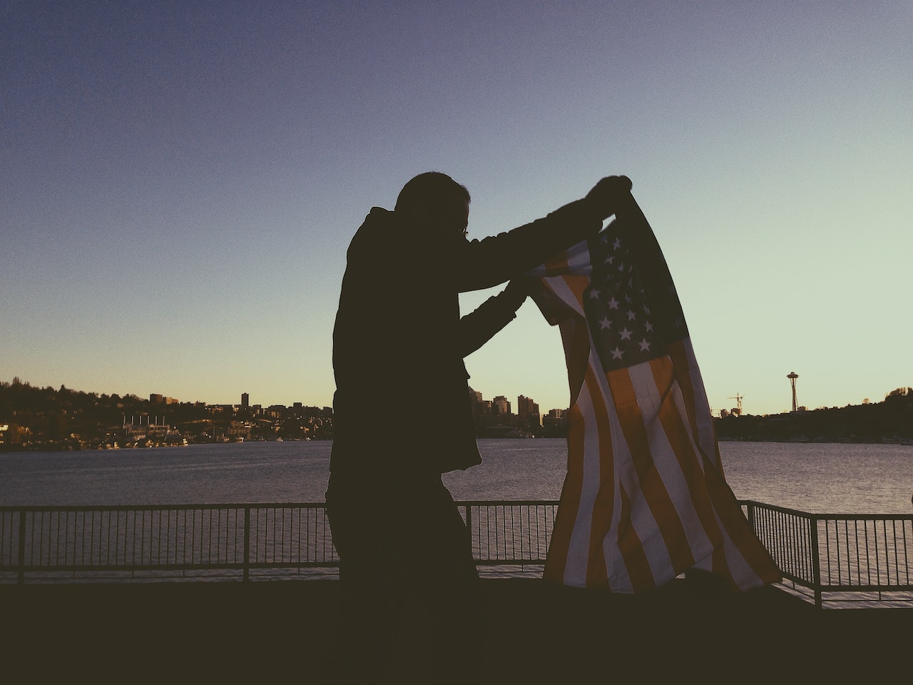 Man Holding Flag of Usa | Veteran car Donations