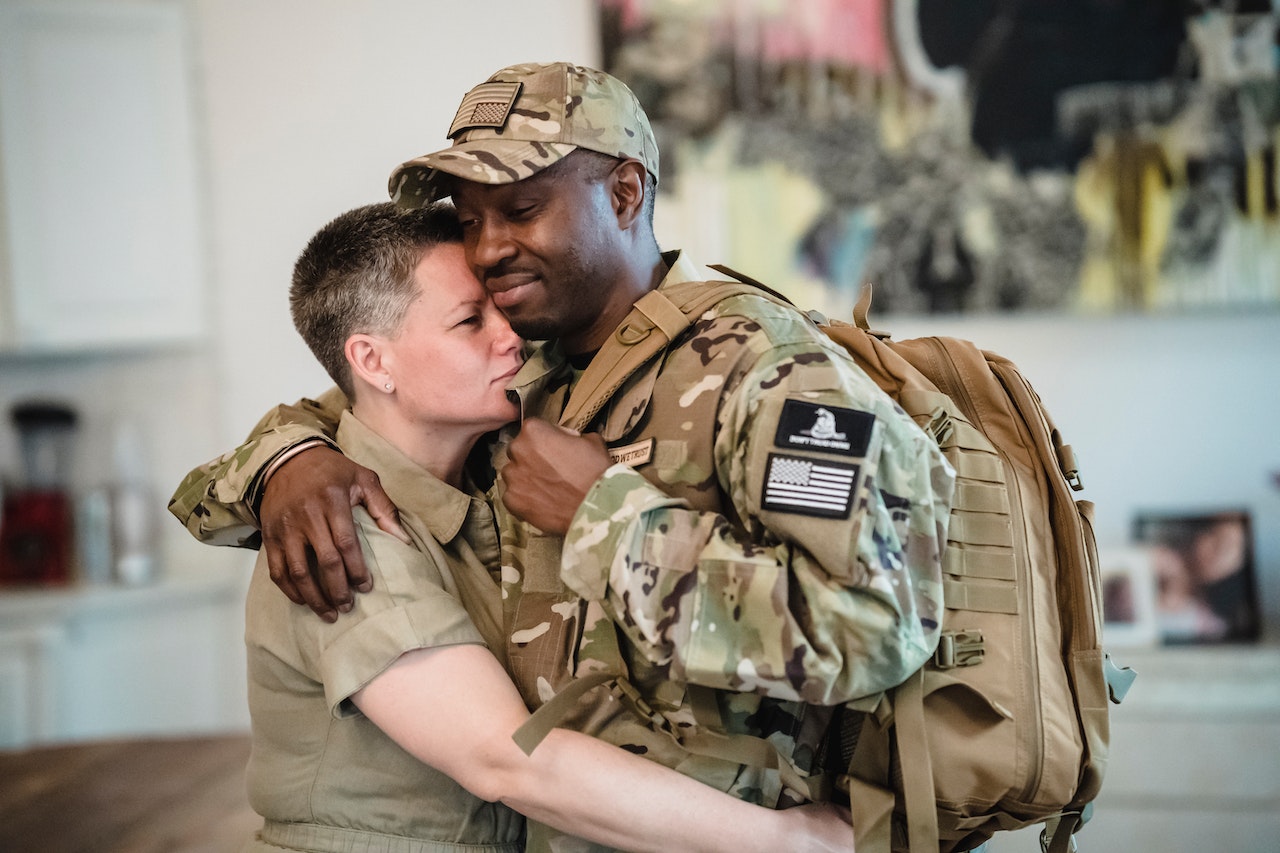 Army Couple Hugging Each Other | Veteran Car Donations