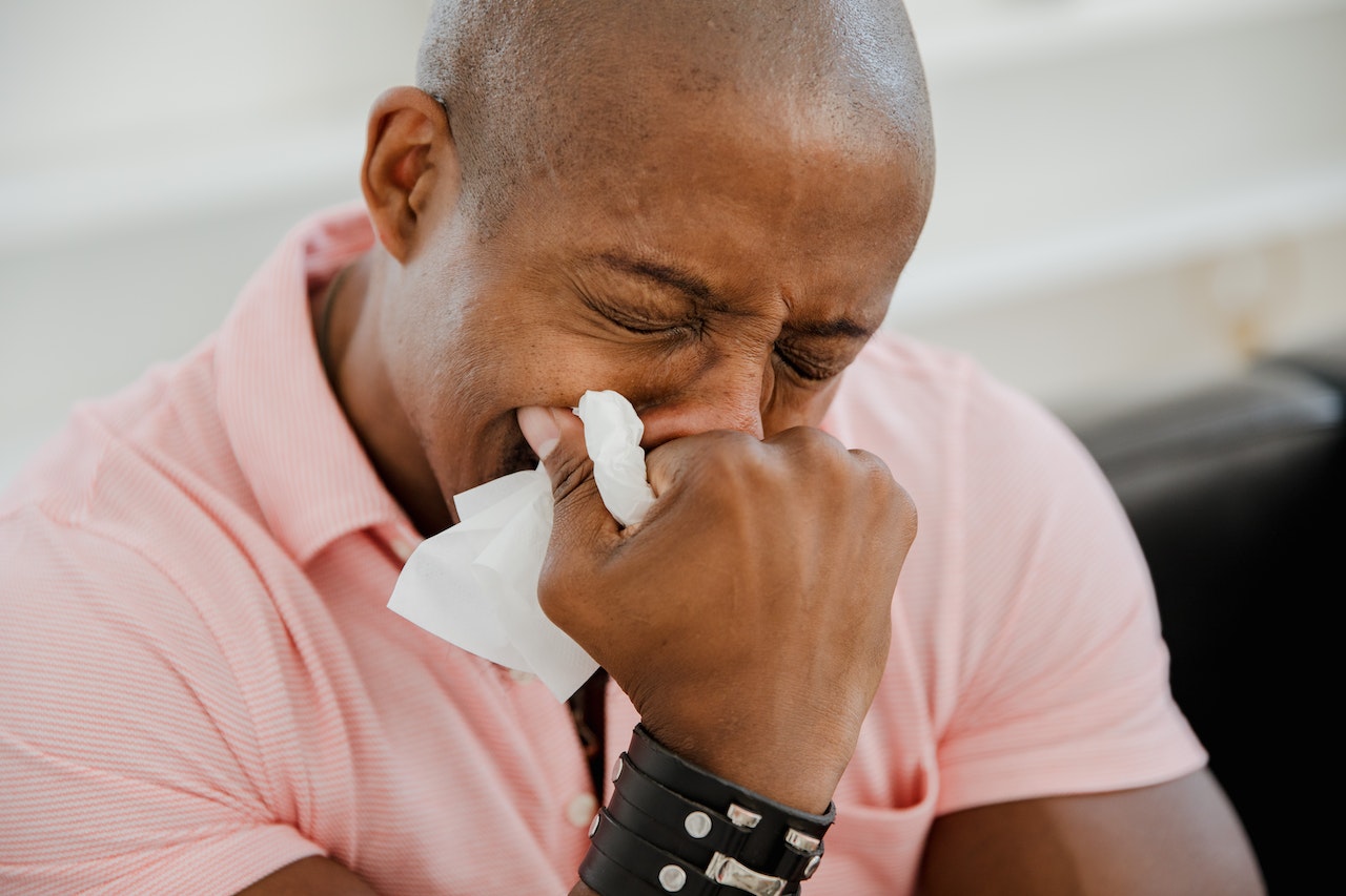 Close-Up Photo of Man Crying in Pink Shirt | Veteran Car Donations