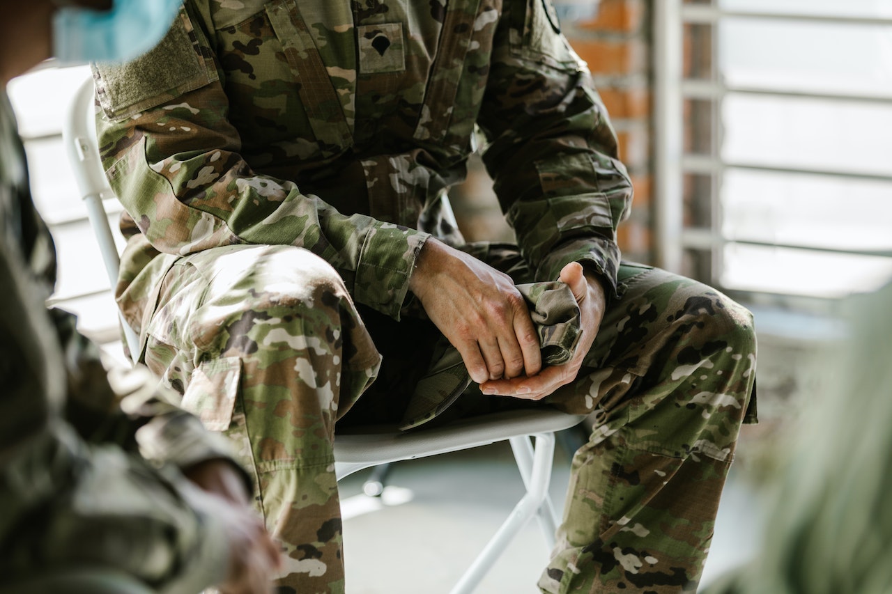 Photo of Person in Green and Brown Camouflage Uniform | Veteran Car Donations