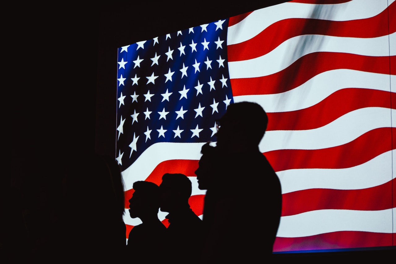 Silhouette of Four Person With Flag of United States Background | Veteran Car Donations
