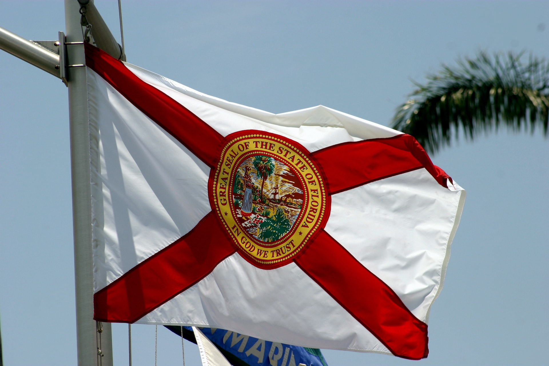 The state flag of Florida flies on a ship's mast | Veteran Car Donations