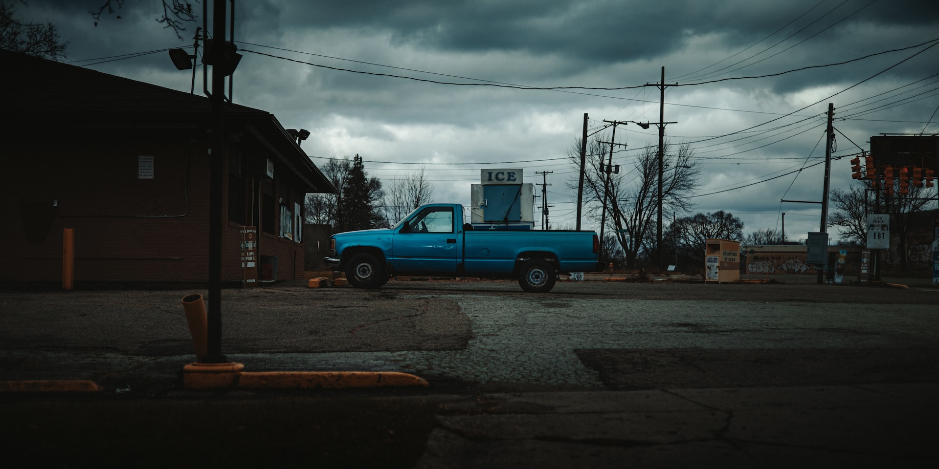 a blue truck parked on the side of a street photo | Veteran Car Donations