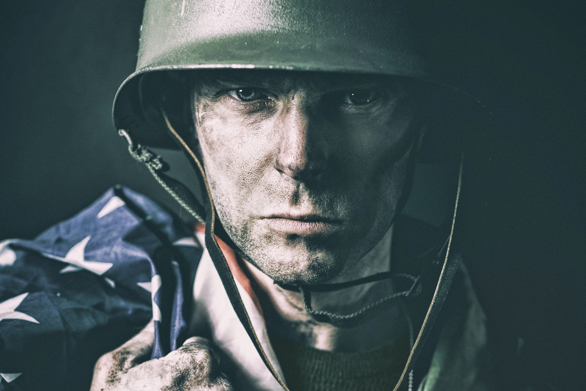 man in black hat and green jacket photo | Veteran Car Donations