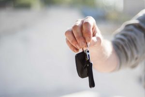 Person Holding a Car Key | Veteran Car Donations