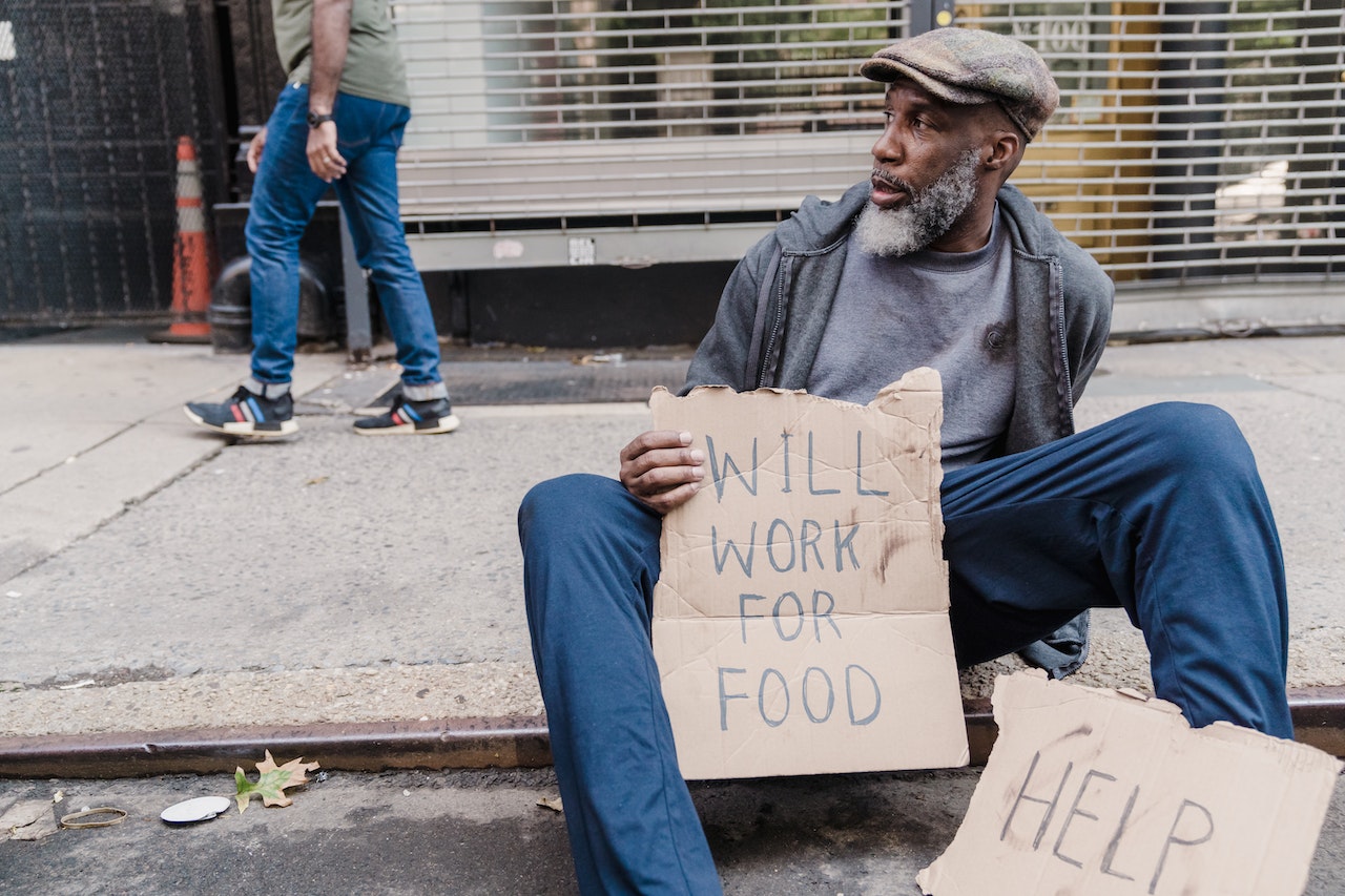 Homeless Man Sitting on the Sidewalk | Veteran Car Donations