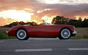 Red Classic Car in Sunset | Veteran Car Donations