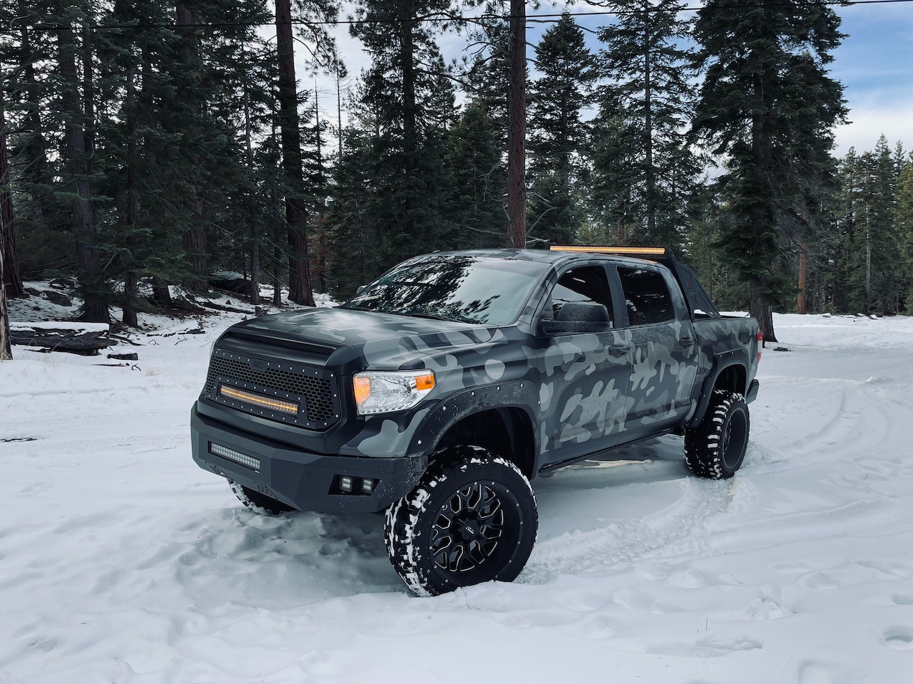 Camo Pickup on Snow | Veteran Car Donations