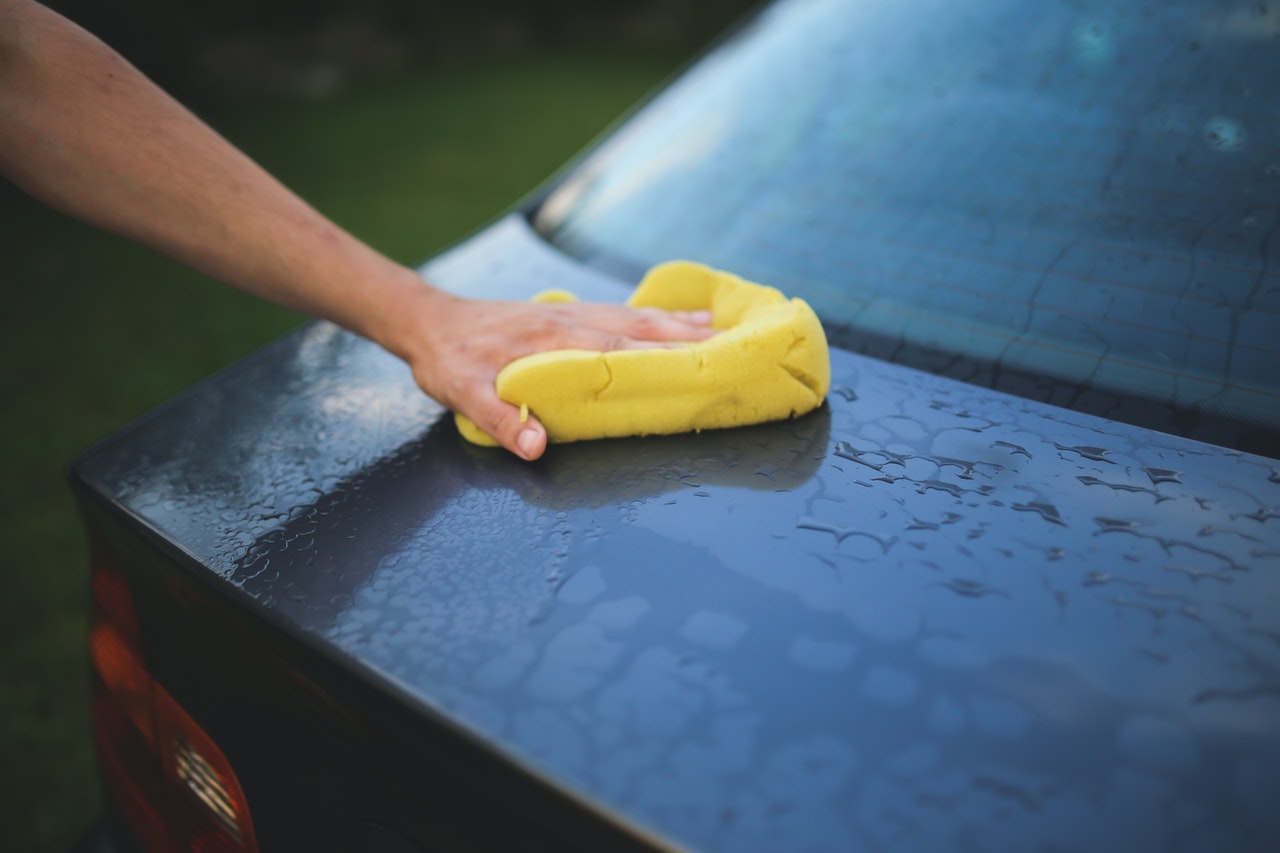 Wiping Down the Car with Sponge | Veteran Car Donations