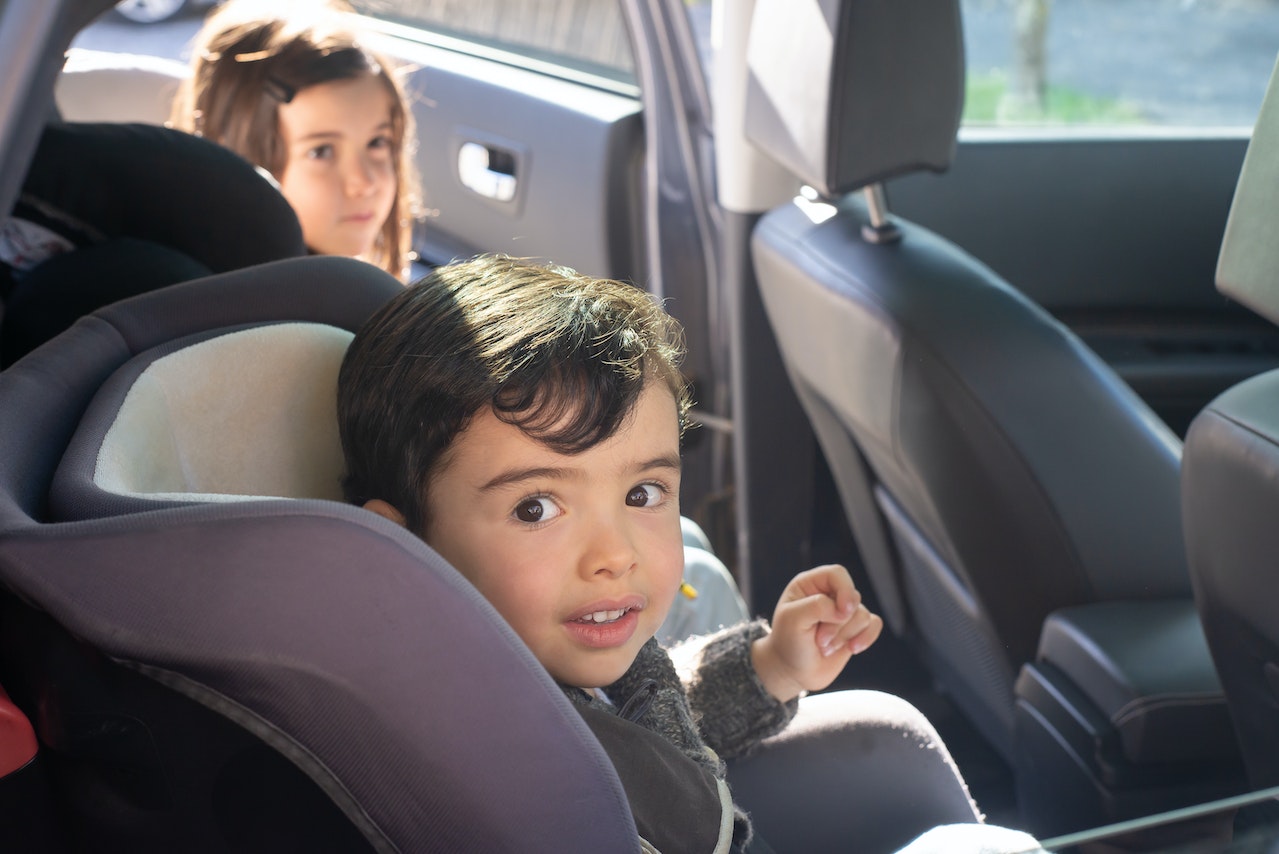 Boy Sitting on Car Seat | Veteran Car Donations