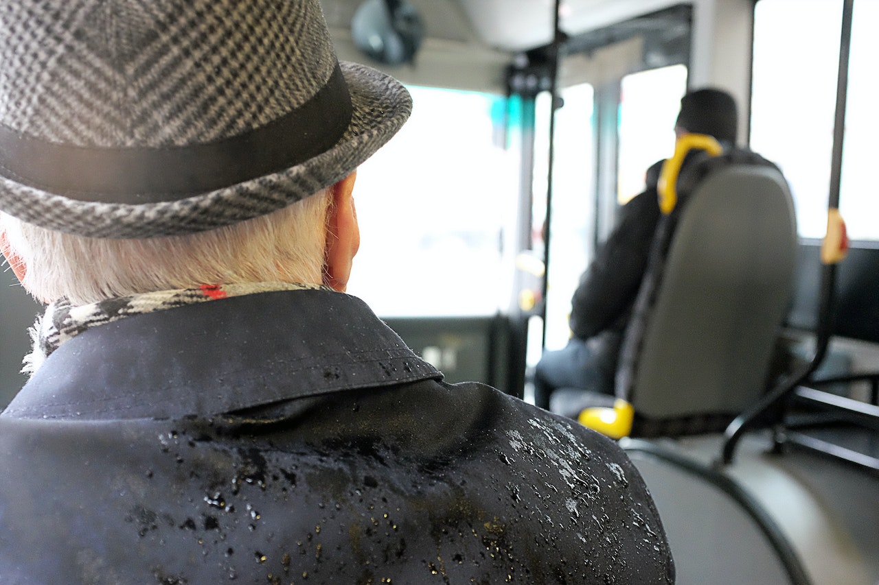 Man Wearing Black Coat While Wet | Veteran Car Donations
