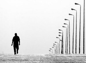 Man Walking Alone Down the Road | Veteran Car Donations
