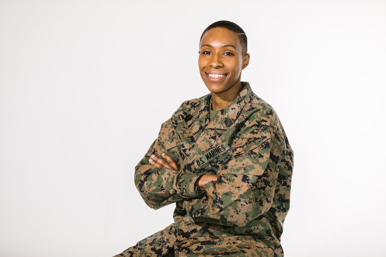 Photo of Smiling Woman in Green and Brown Camouflage Military Uniform | Veteran Car Donations
