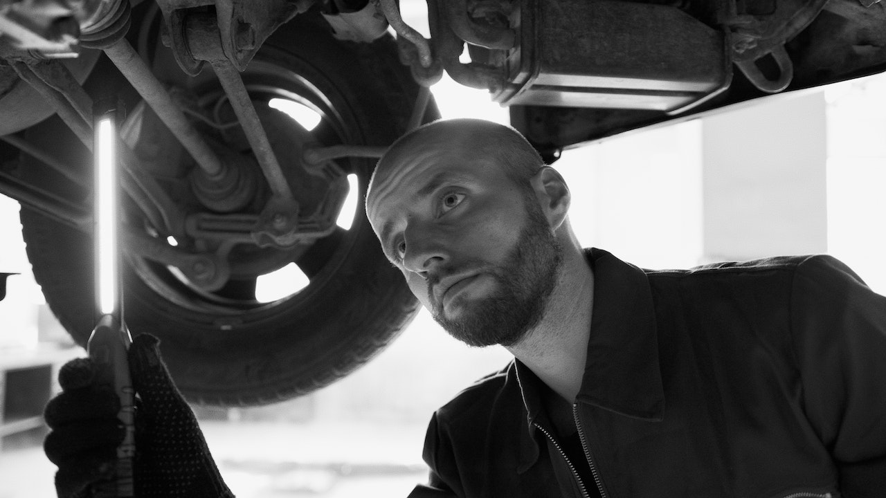 Man Checking Under The Car | Veteran Car Donations