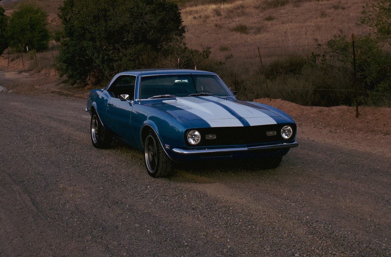 A Chevrolet Camaro on an Unpaved Road | Veteran Car Donations