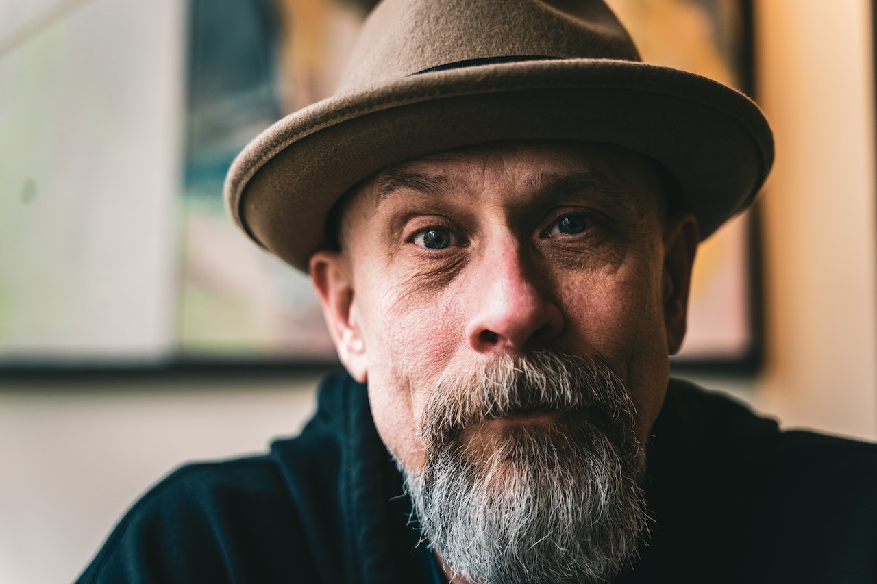 Portrait Of An Old Man Wearing Brown Fedora Hat | Veteran Car Donations
