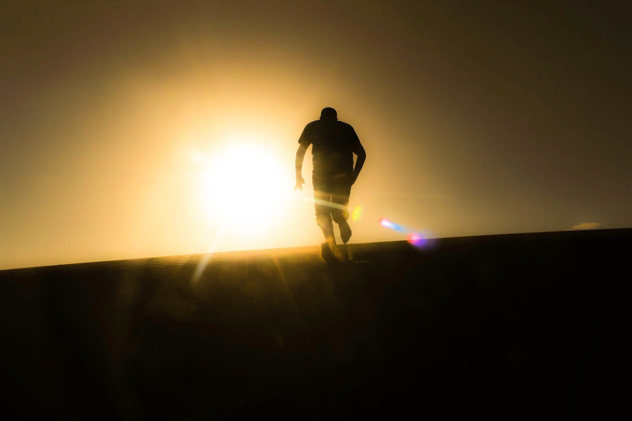 Rear View of Silhouette Man Against Sky during Sunset | Veteran Car Donations
