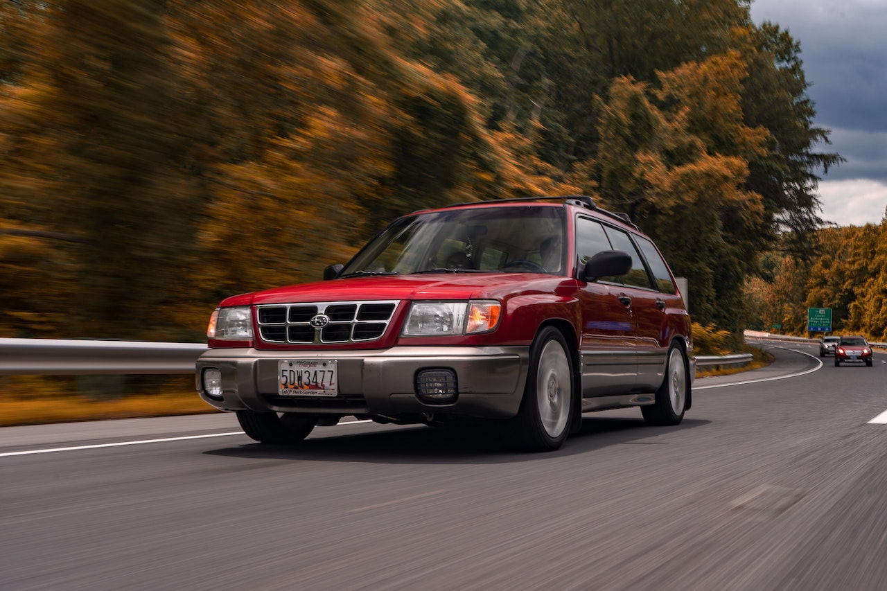 Red Mercedes Benz Suv Moving on Road | Veteran Car Donations