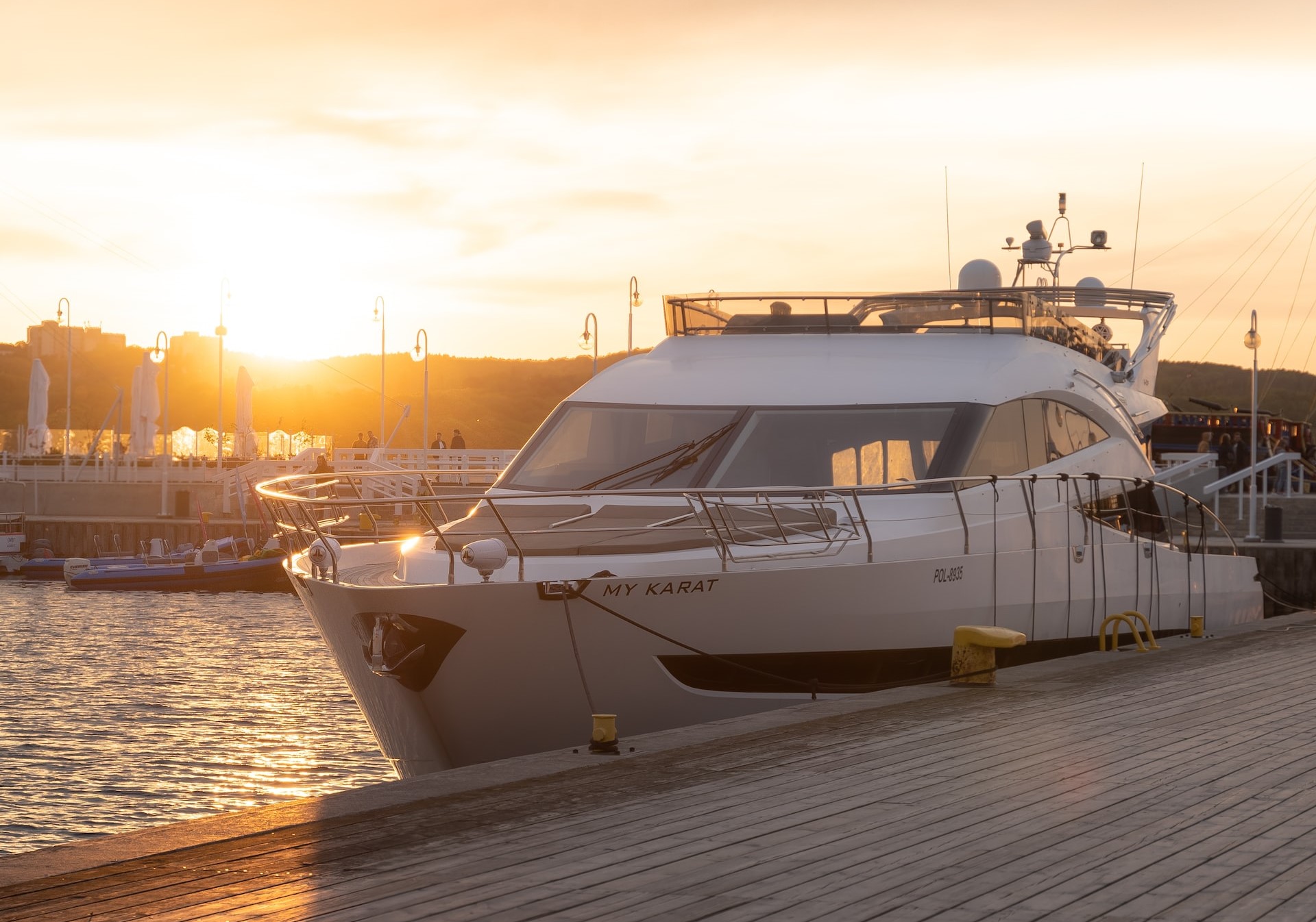 white and black yacht on dock during sunset | Veteran Car Donations