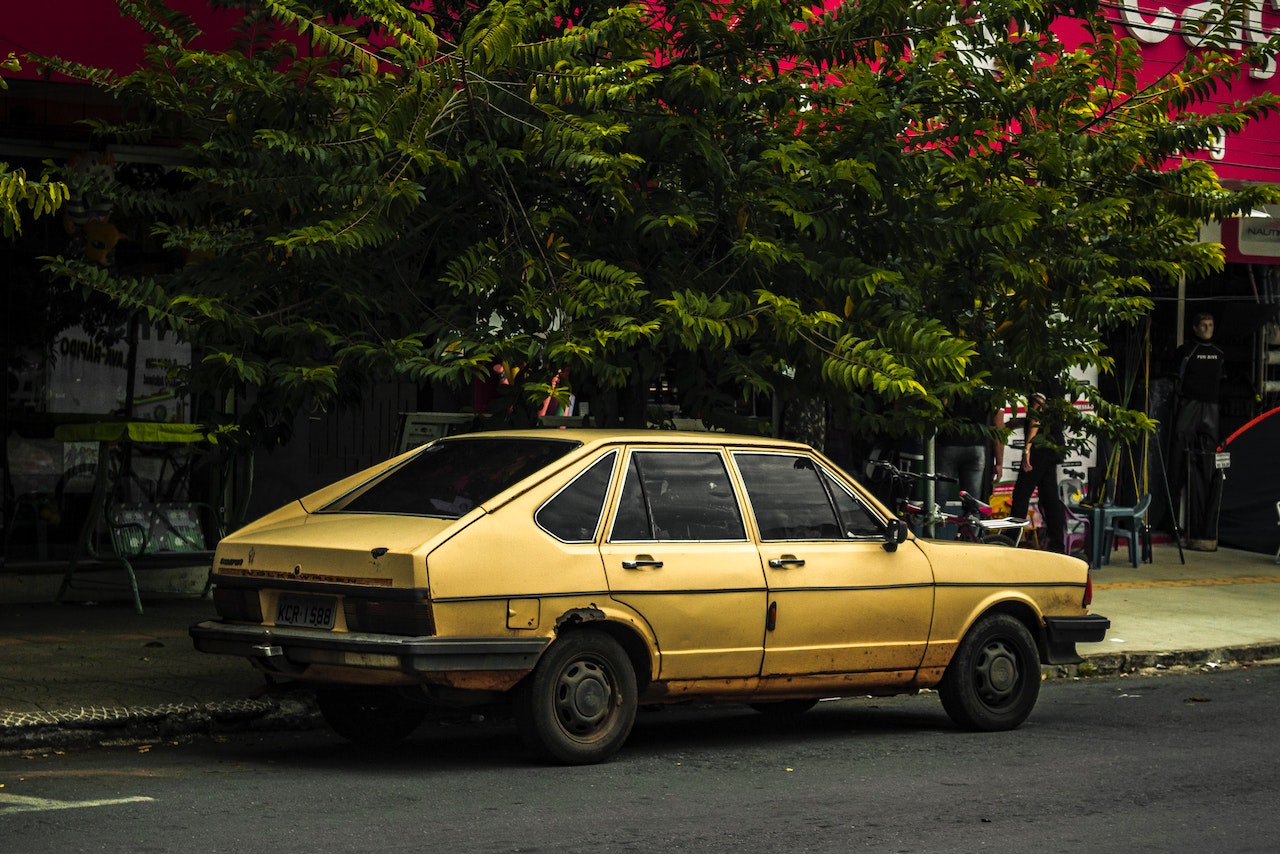 Yellow Sedan Parked | Veteran Car Donations