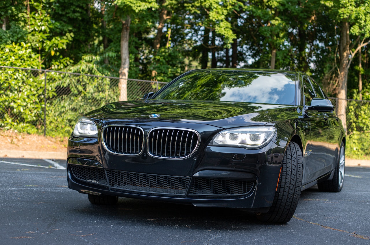 Black BMW parked on Pavement | Veteran Car Donations