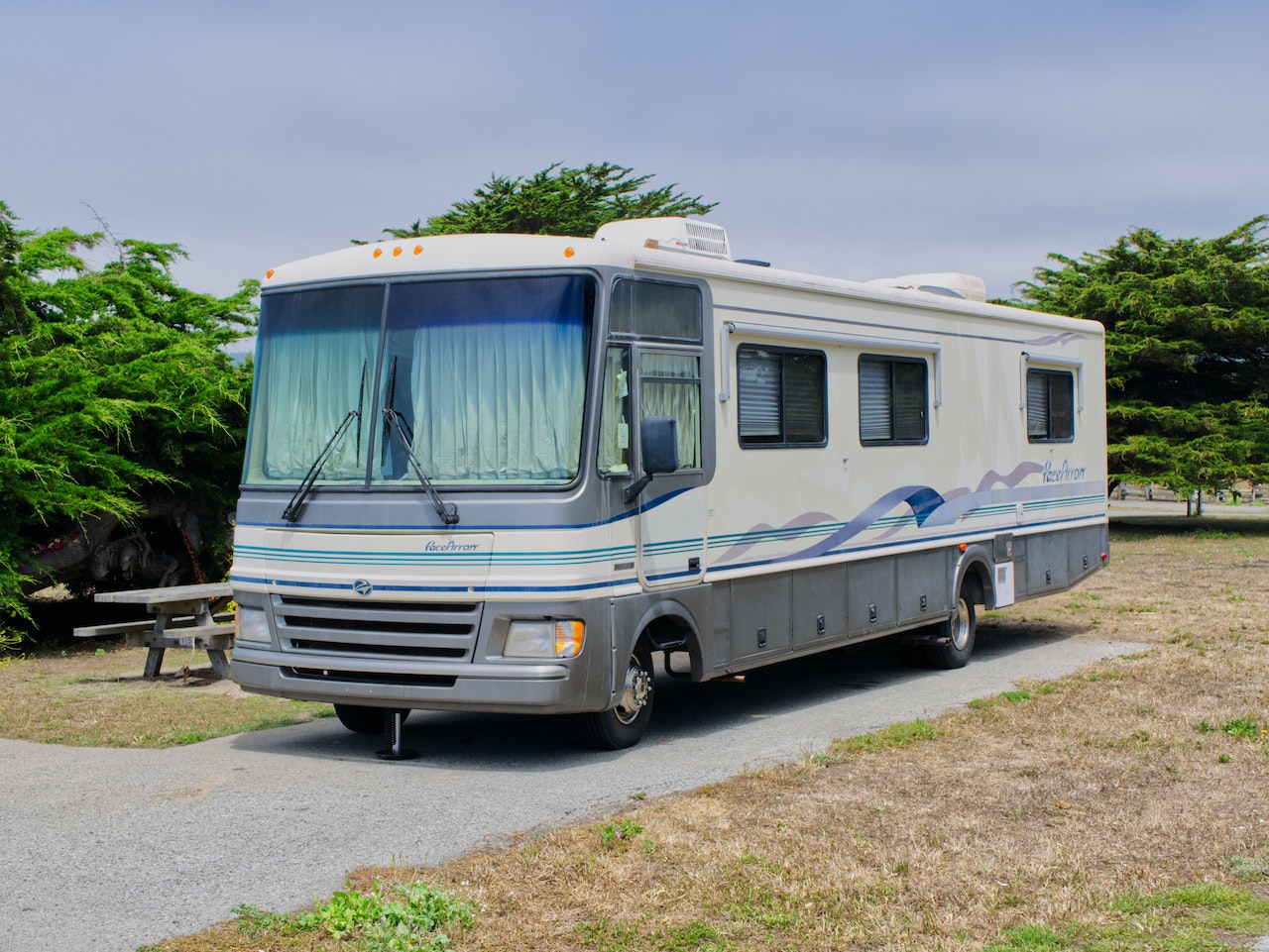 Camper Bus Park Beside the Bench in the Park | Veteran Car Donations