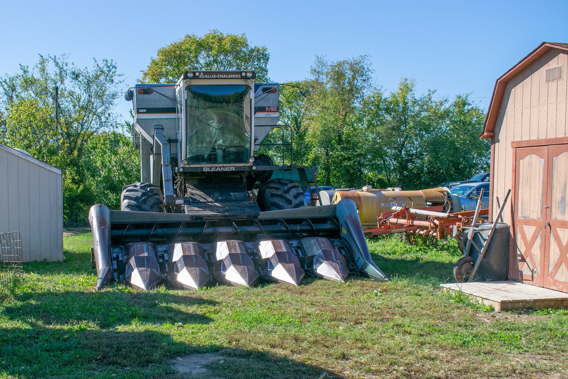 Combine Harvester Parked Beside the Barn | Veteran Car Donations
