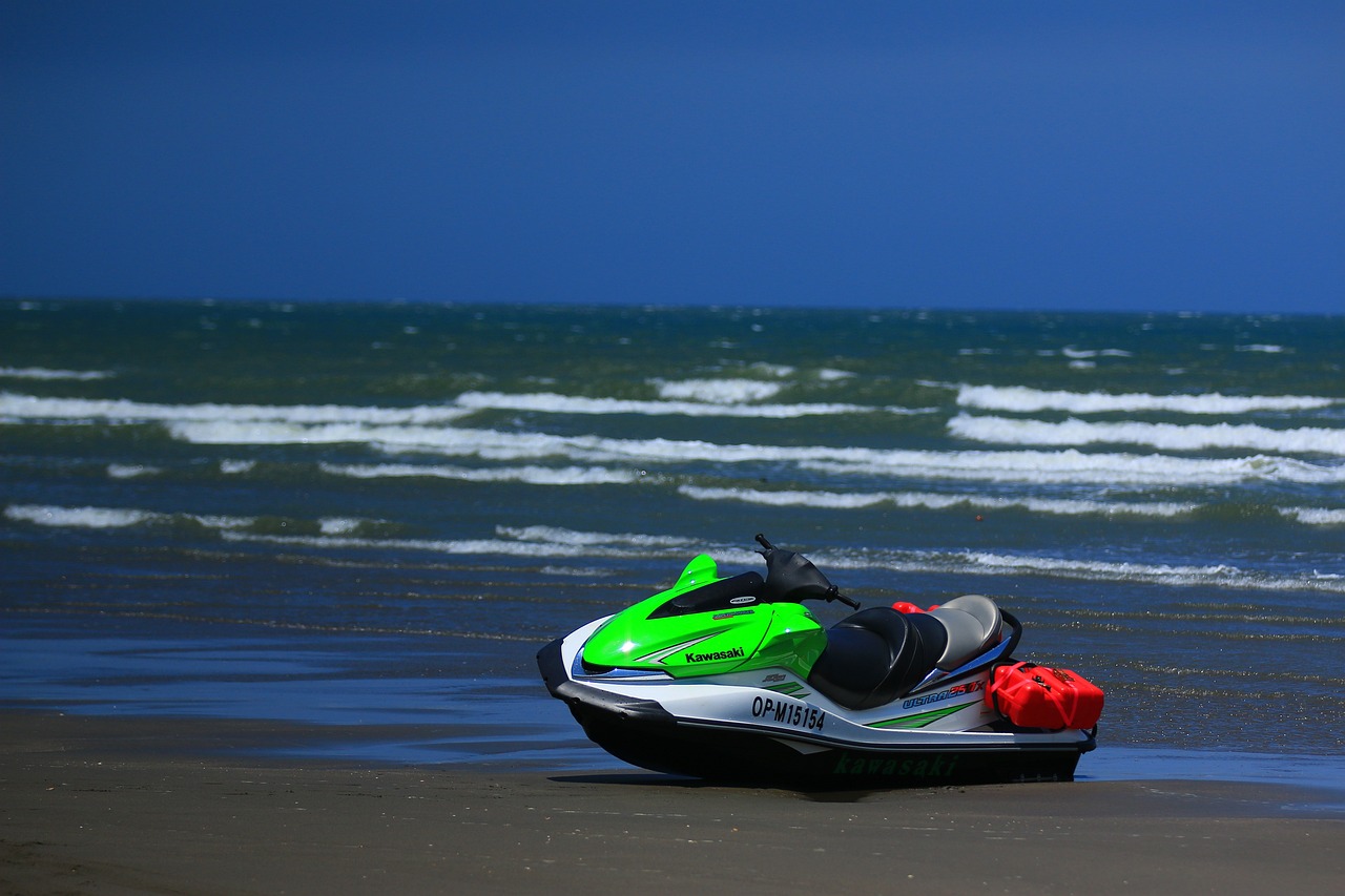 Green Kawasaki Jetski in the Shore | Veteran Car Donations