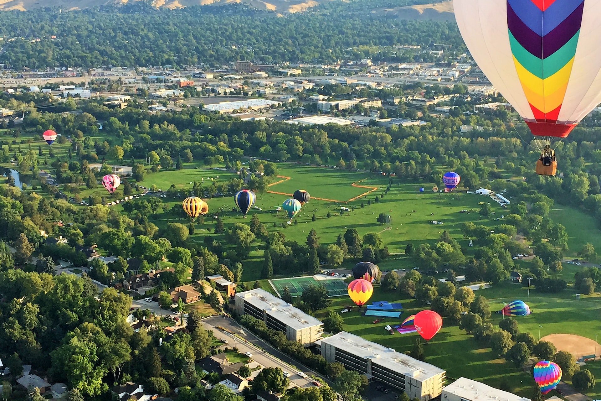 Hot air balloons landing throughout Ann Morrison park during the Spirit of Boise hot air balloon rally | Veteran Car Donations