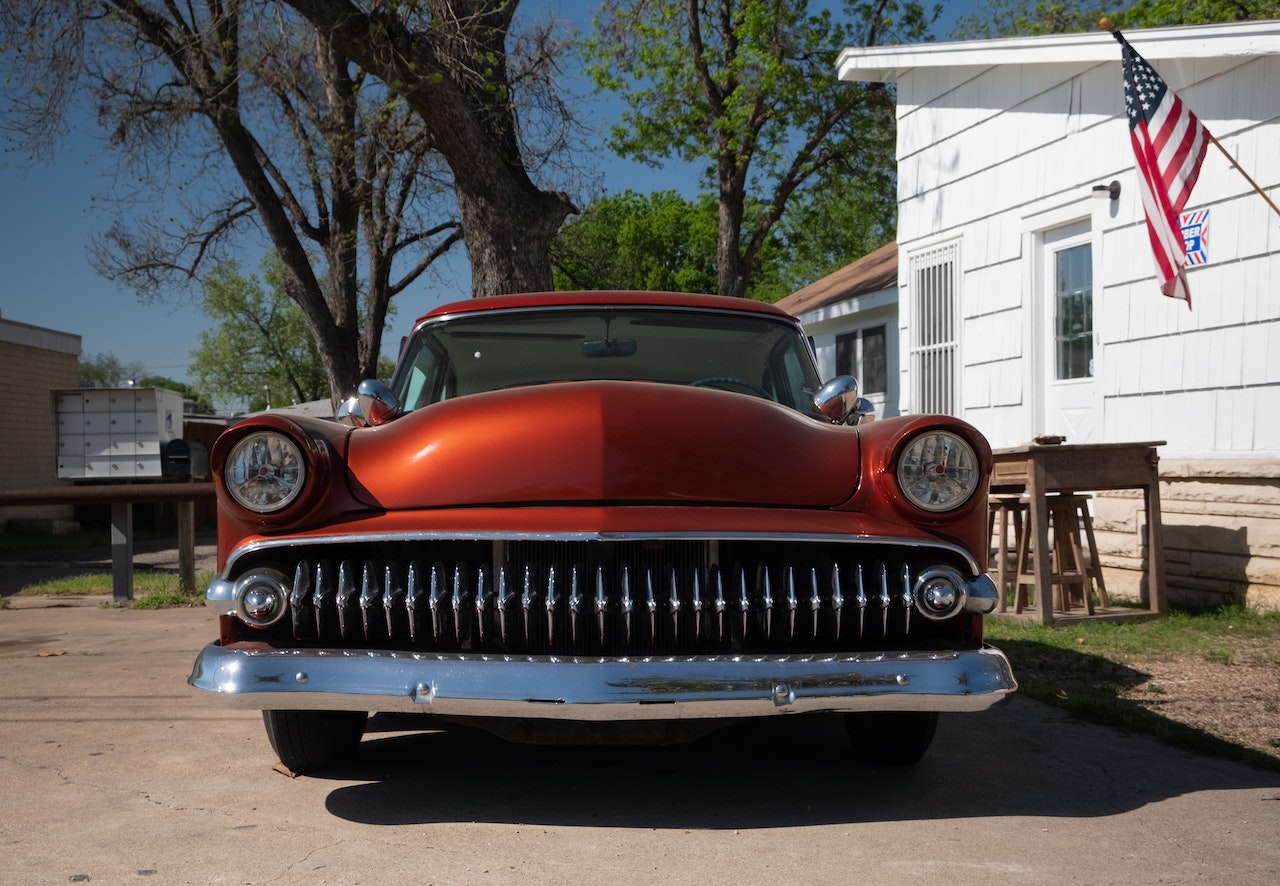 Old Red Car parked outside | Veteran Car Donations