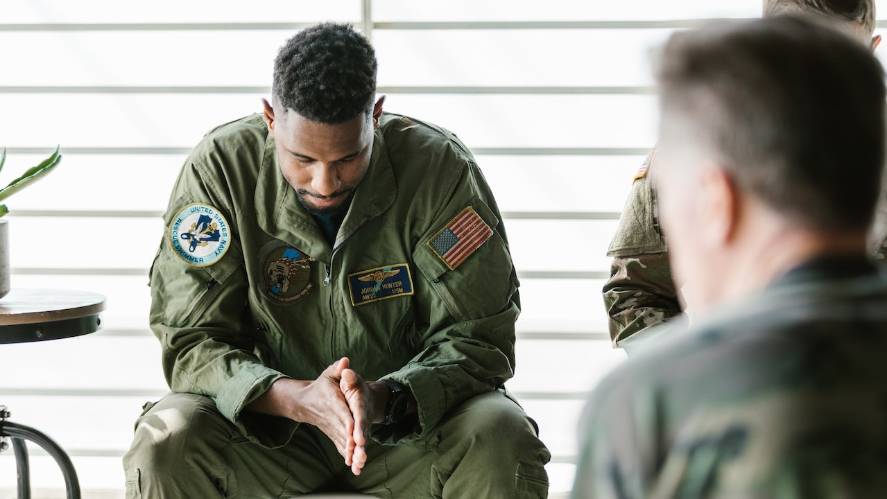 Photo of Soldier Looking Down | Veteran Car Donations