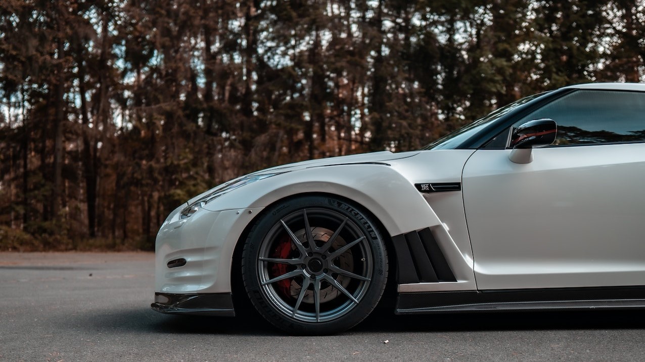 Silver Nissan GTR on Gray Asphalt Road | Veteran Car Donations