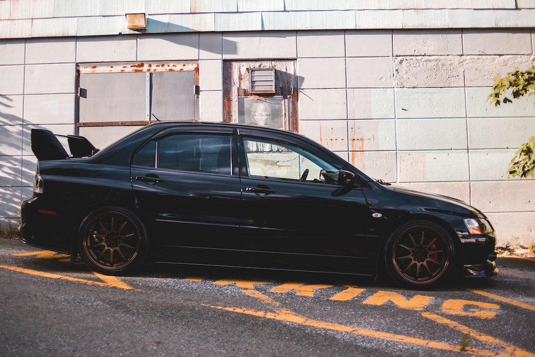 Sports car parked on slope road in daytime | Veteran Car Donations