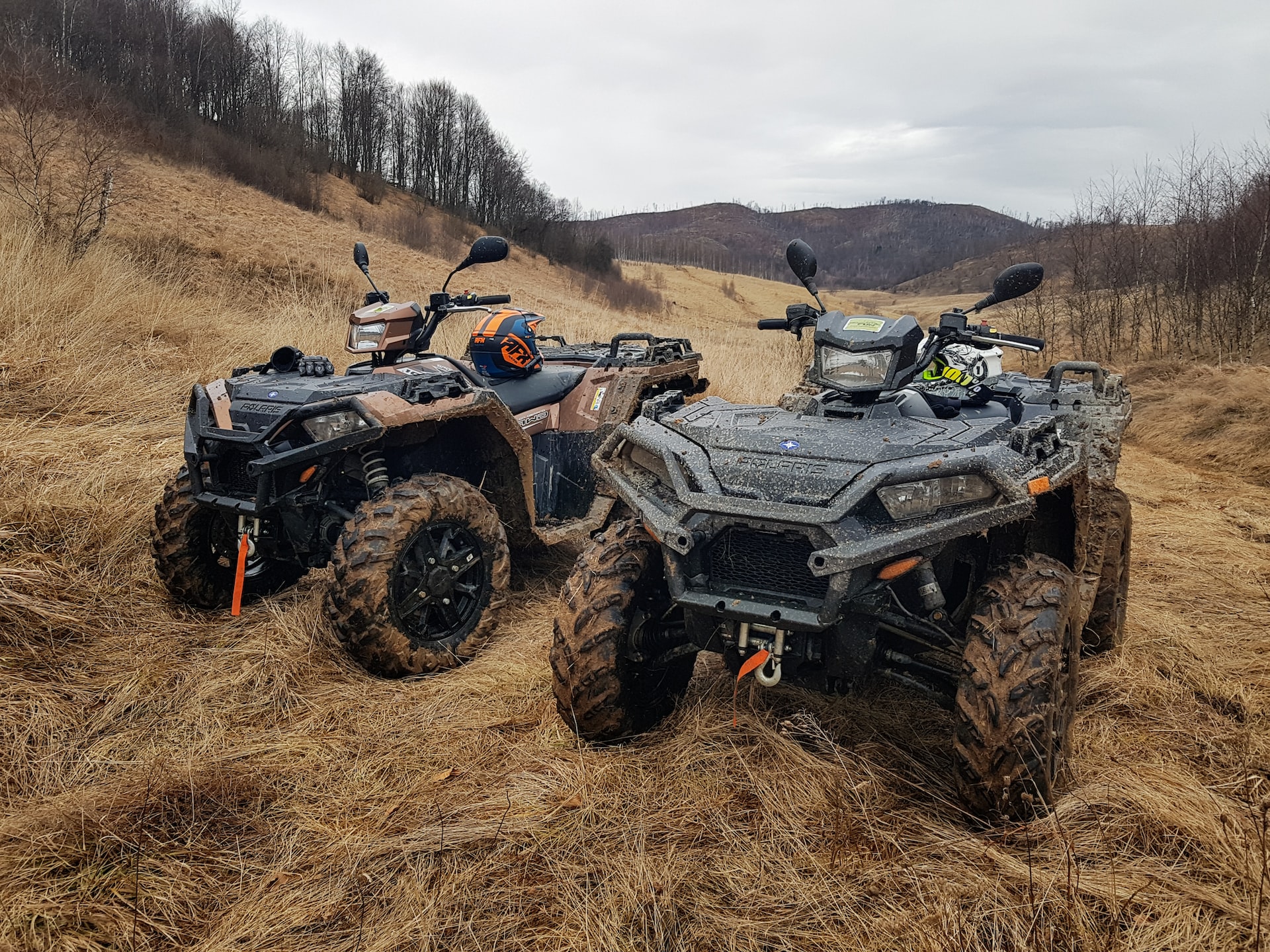 Two Muddy ATV Parked | Veteran Car Donations