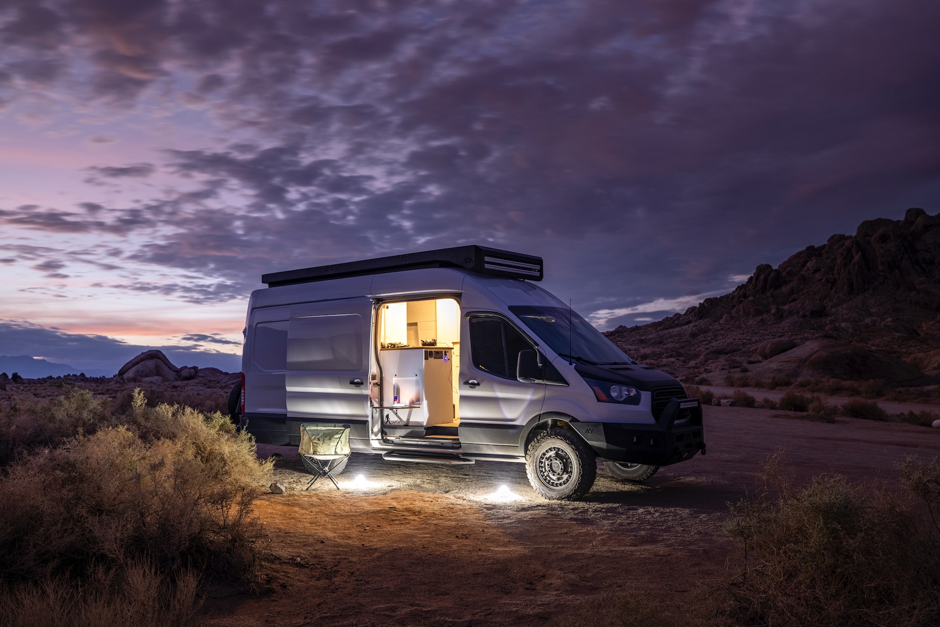 White RV camper parked on field | Veteran Car Donations