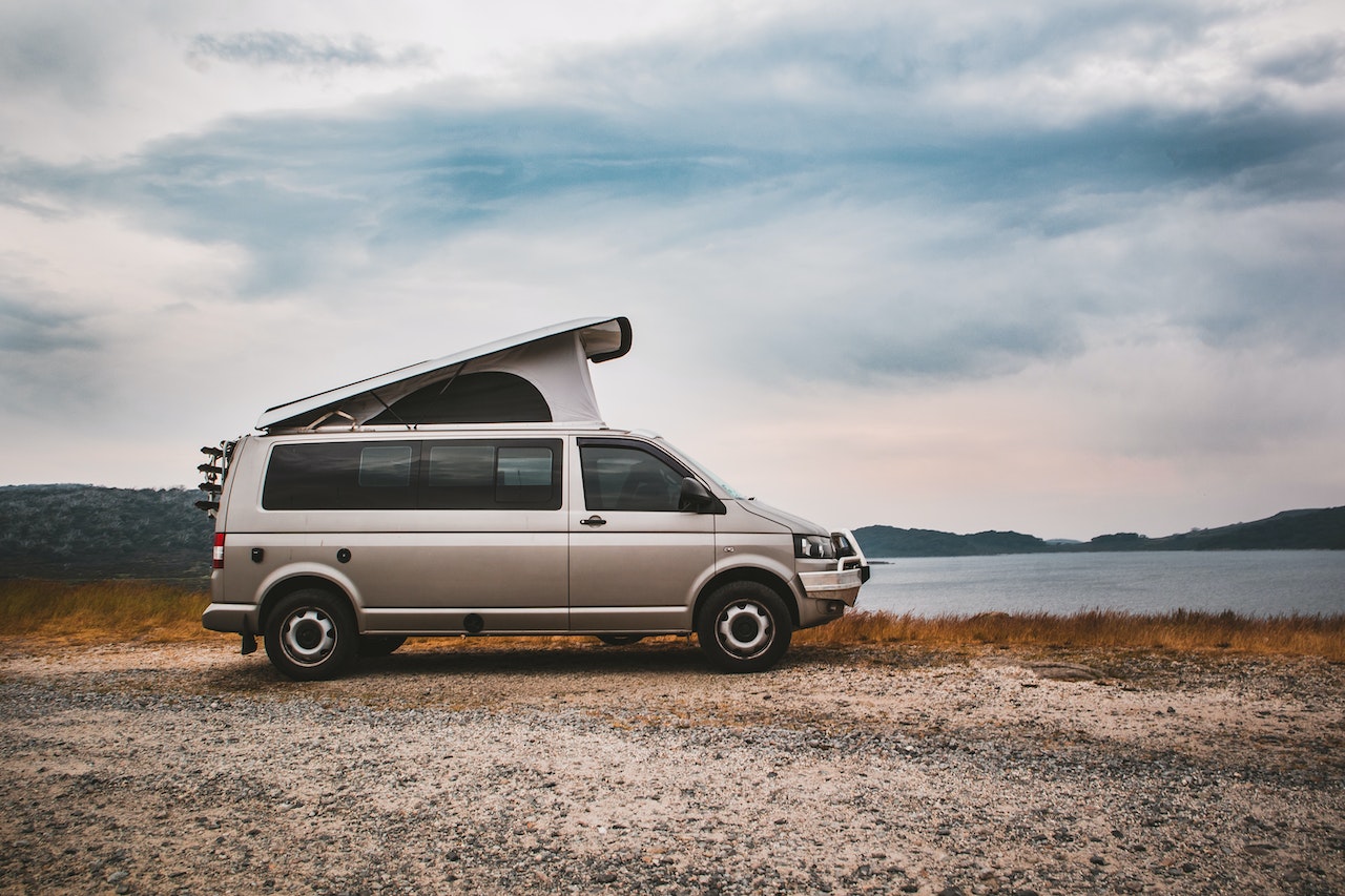 White Van on Brown Field Under White Clouds | Veteran Car Donations