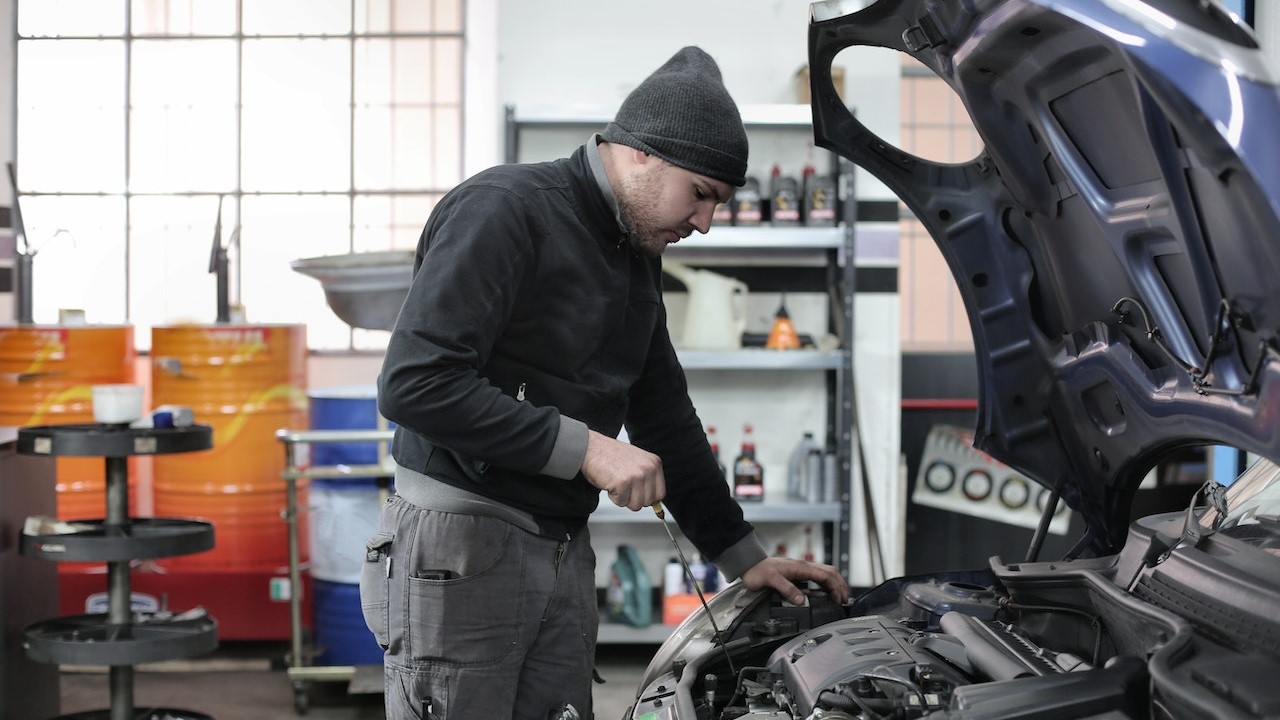 Man Inspecting Car Engine | Veteran Car Donations