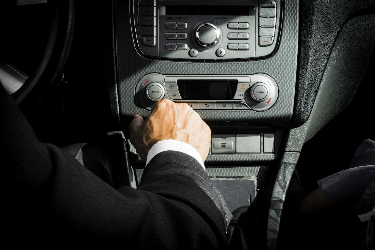 Man in Black Suit Inside Car | Veteran Car Donations